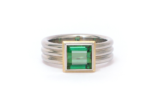 Square cut green Tourmaline Gemstone ring in yellow setting on white gold band in 18karat by Martinus